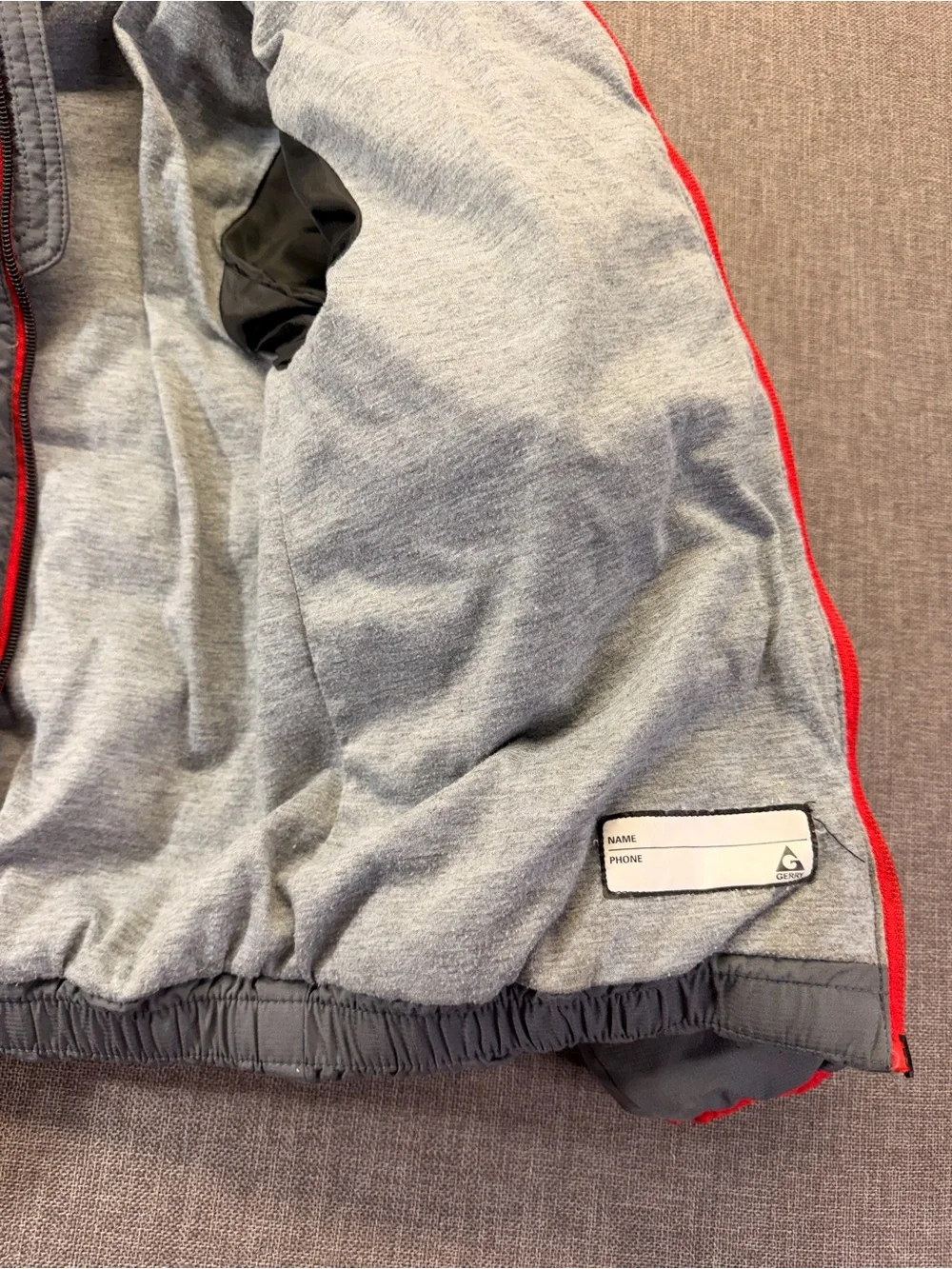 Gray Quilted Hooded Puffer Jacket with Red Trim size 6 kids.
